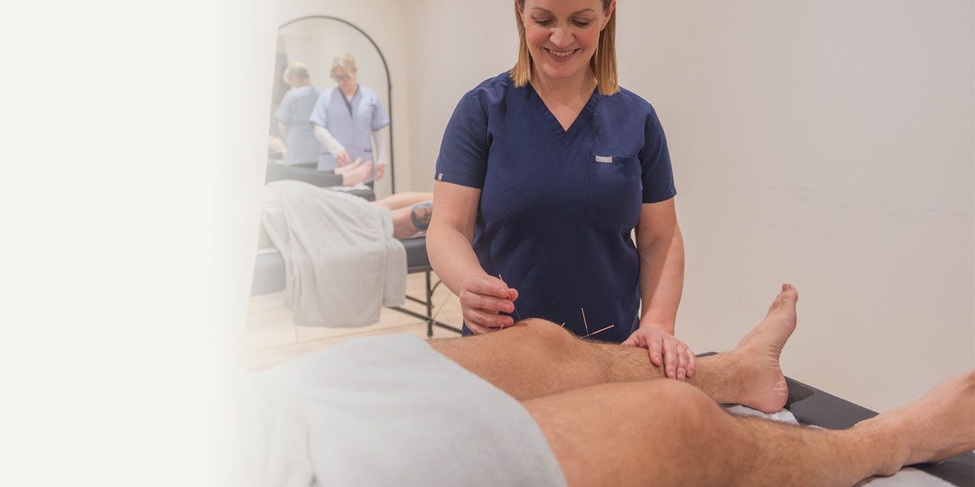 Photo of Jen treating acupuncture patient.