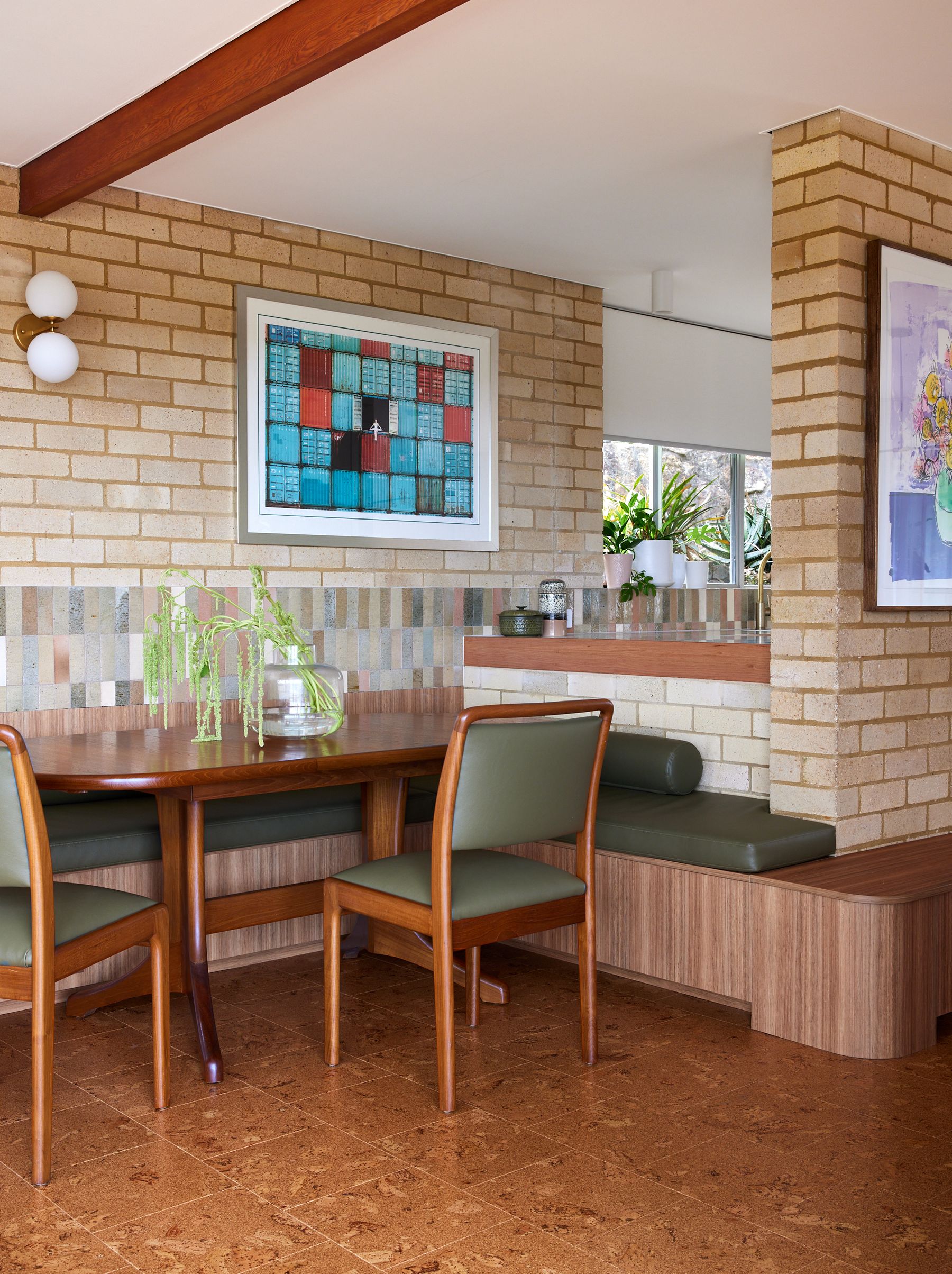 Wooden dining room table with upholstered chairs