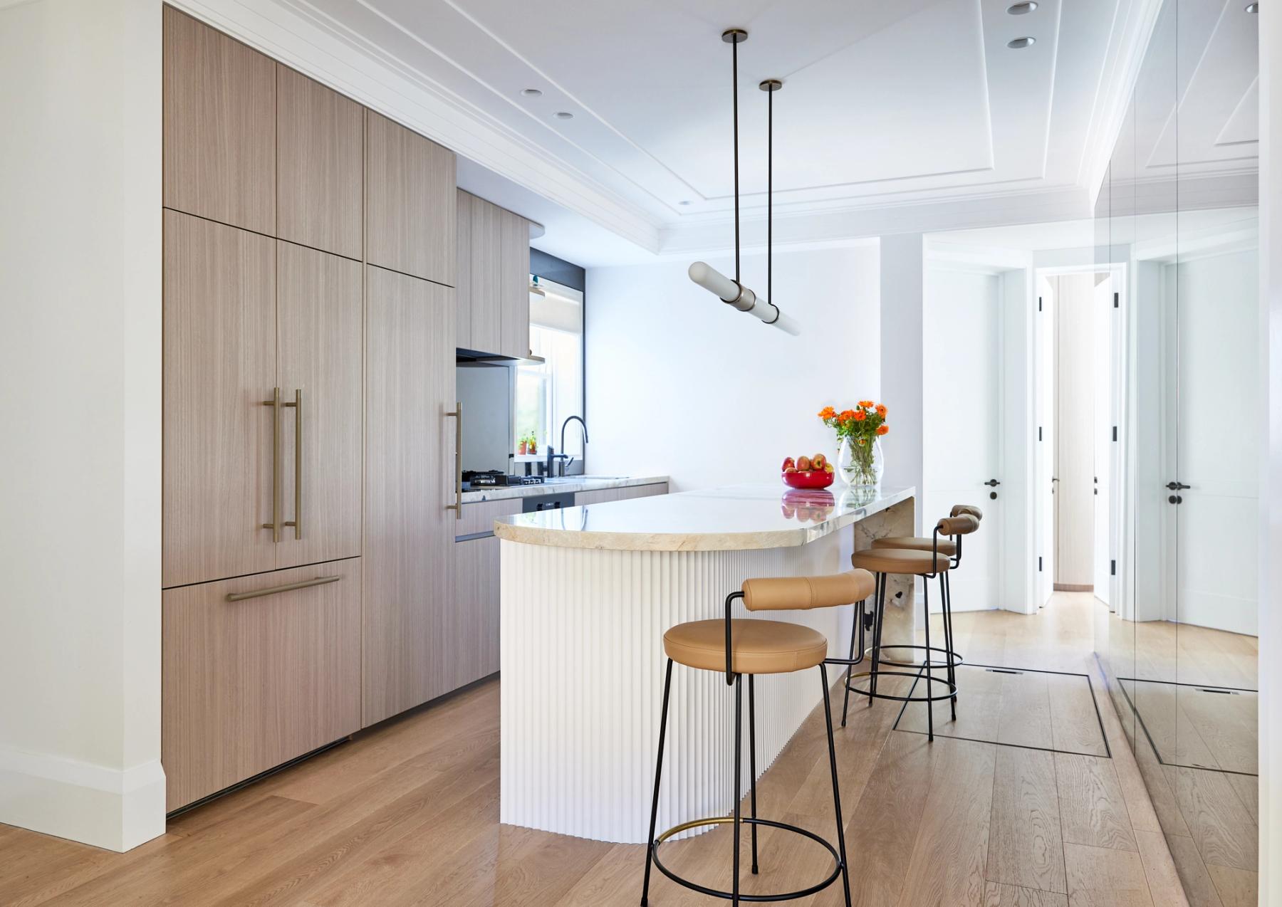 Kitchen with stone benchtop and stools