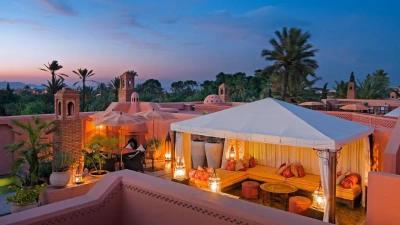 Luxurious hotel in Marrakech, Morocco, showcasing opulent architecture and vibrant surroundings.