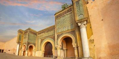 The entrance to the city of Marrakesh, showcasing traditional Moroccan architecture and vibrant colors.