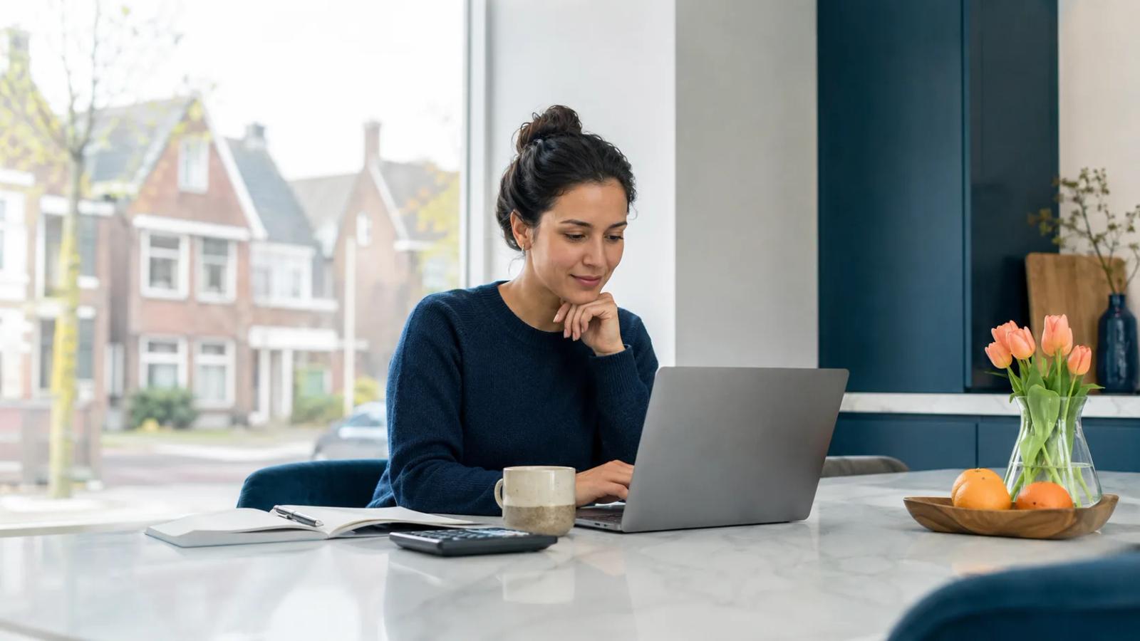 Person budgeting monthly expenses for life in the Netherlands