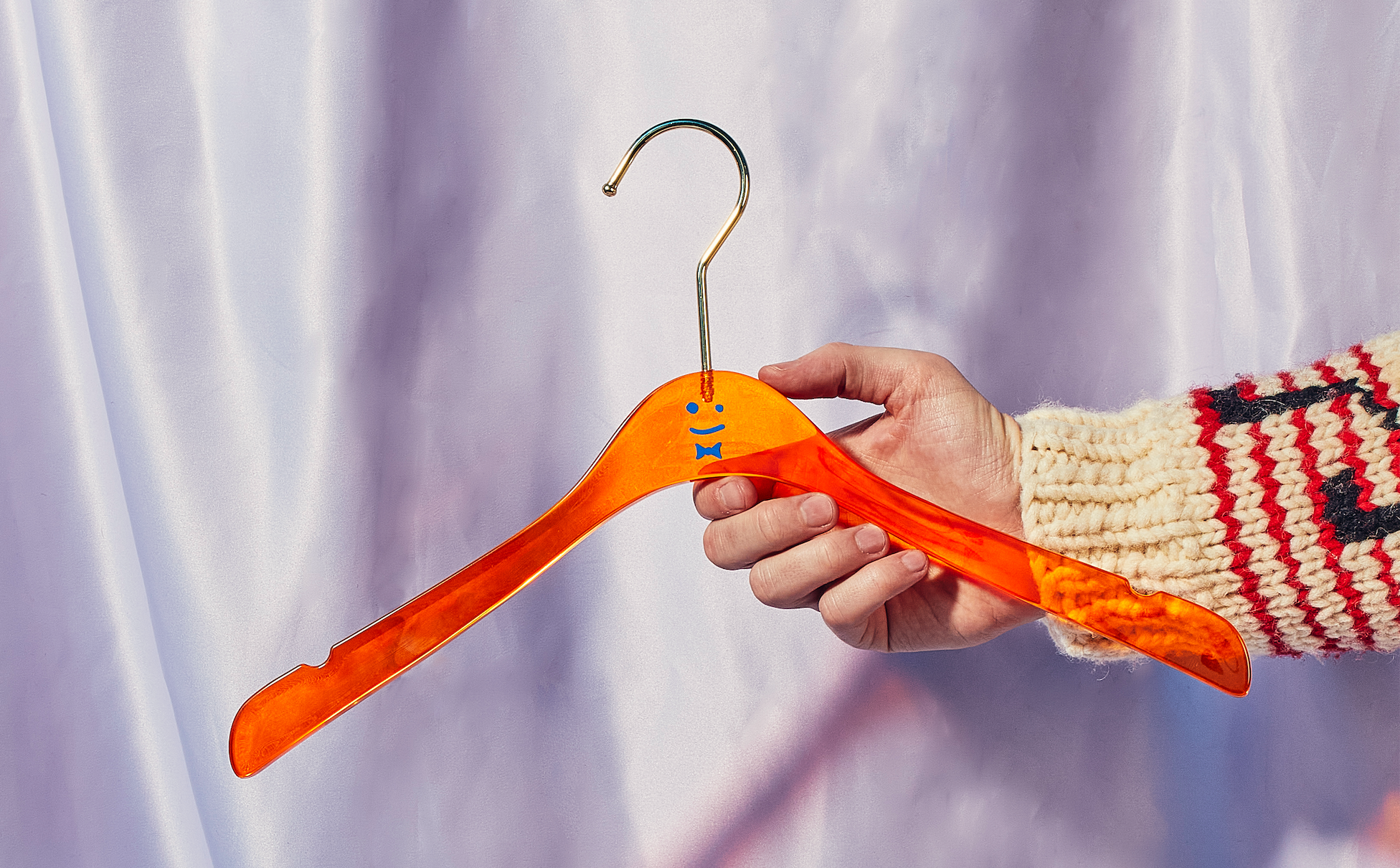 Orange hanger with hand