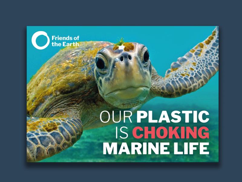 Friends of the Earth - Ocean plastic campaign poster showing a Sea Turtle underwater with the caption "Our plastic is choking marine life".