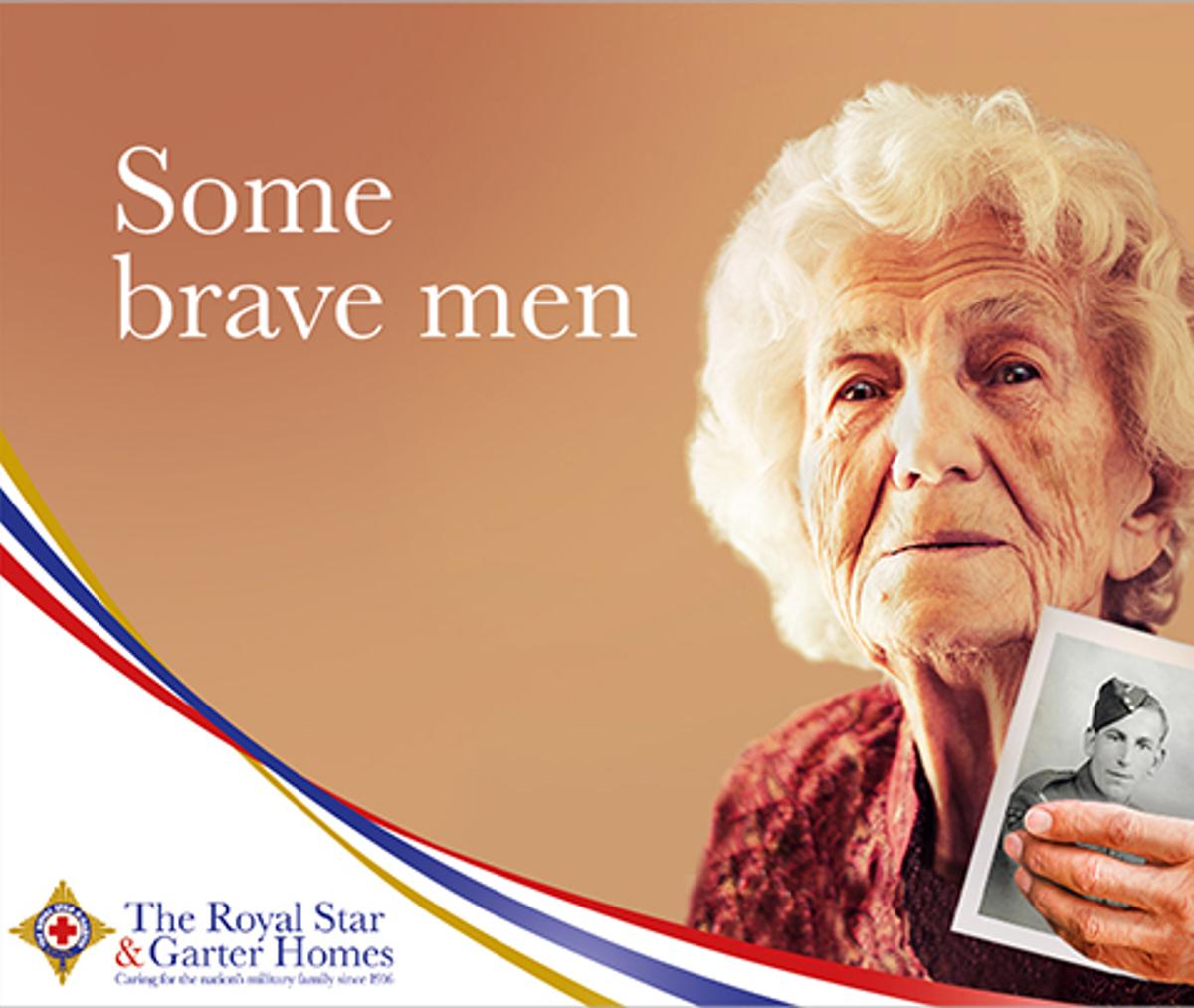 An old woman holding a black and white picture of a young soldier with the caption "Some brave men".