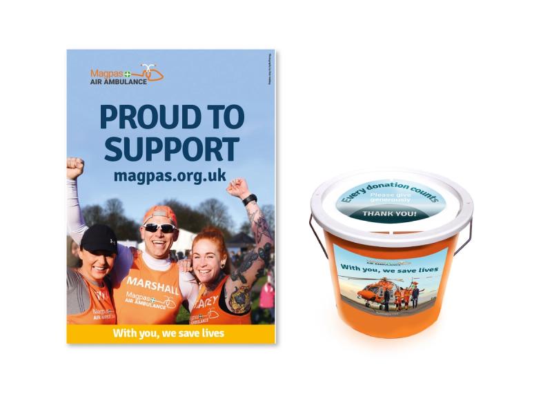 Magpas Air Ambulance fundraising campaign poster with the caption "Proud to support" and a donation bucket.