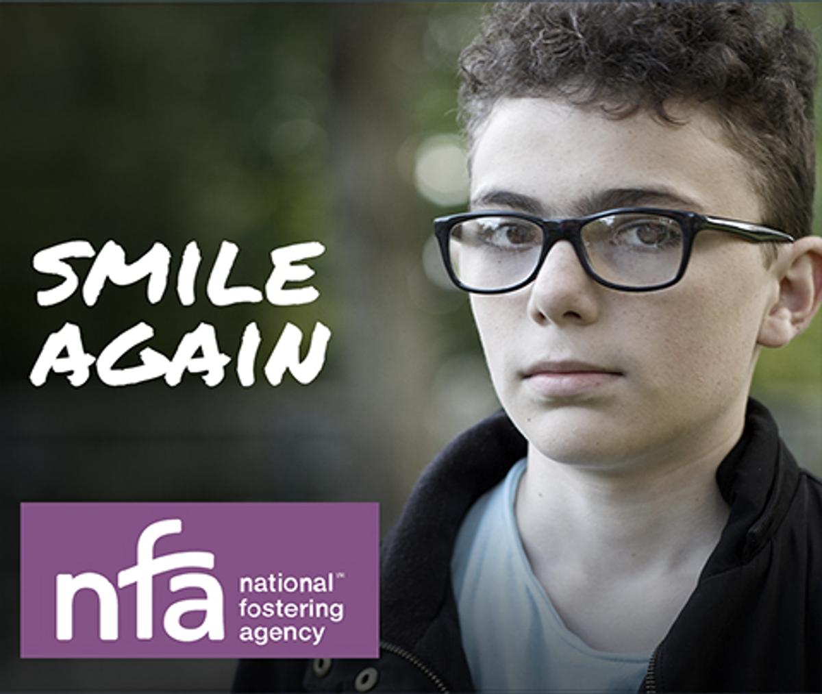 National Fostering Agency campaign web advert frame showing a sepia tone image of a young boy with the caption "Smile again".