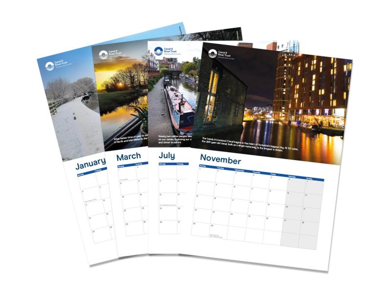 Canal & River Trust four tent calendar pages with various images and monthly calendar views laid on top of each other in a fan shape.