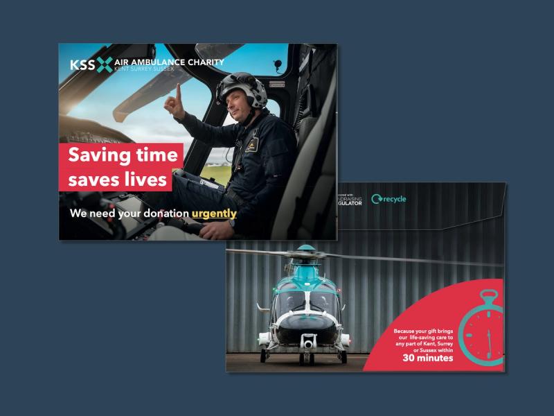 KSS Air Ambulance - Saving time saves lives campaign envelope pages displaying an image of a helicopter pilot to the front and a helicopter to the reverse.