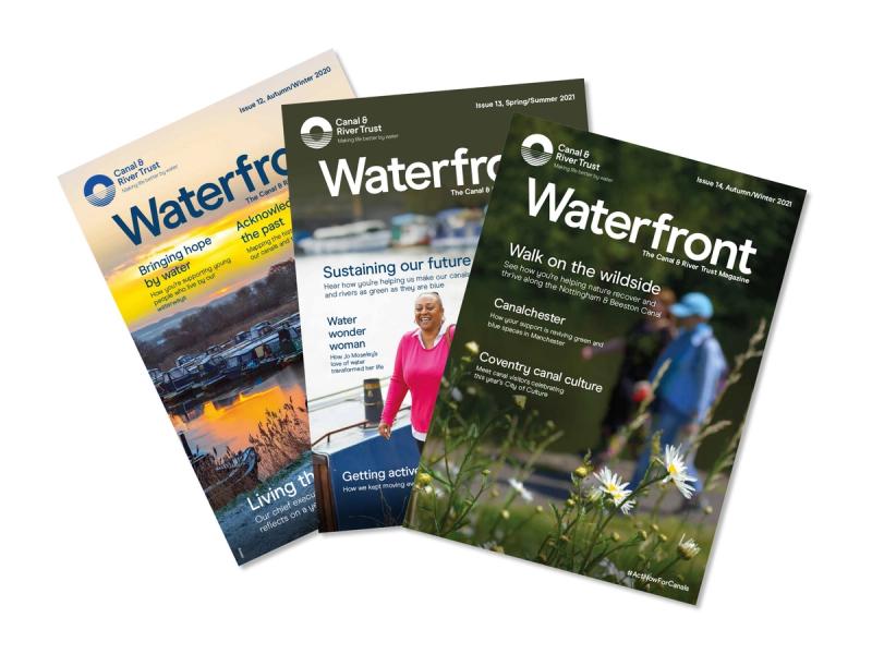 Canal & River Trust magazine covers laid on top of each other in a fan shape with the word 'Waterfront' emblazoned on the front.