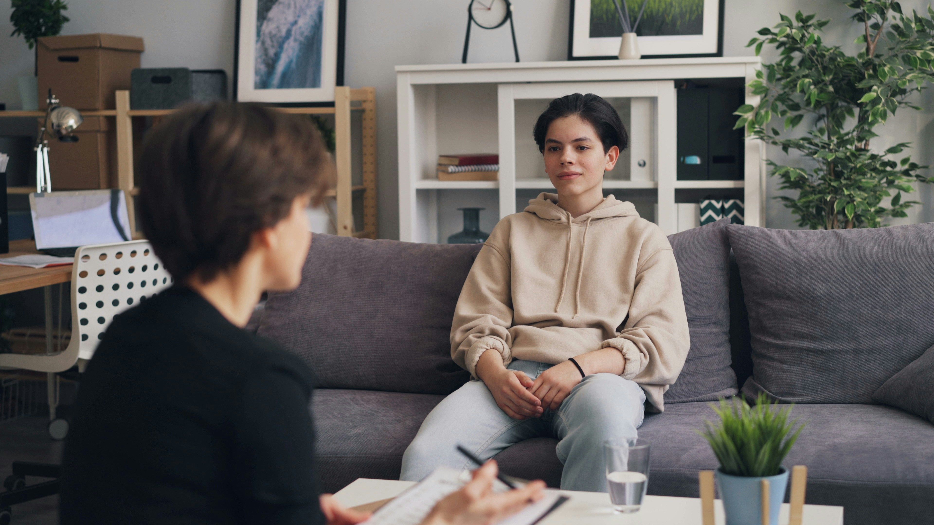 A practitioner listens during a calm one-to-one conversation.