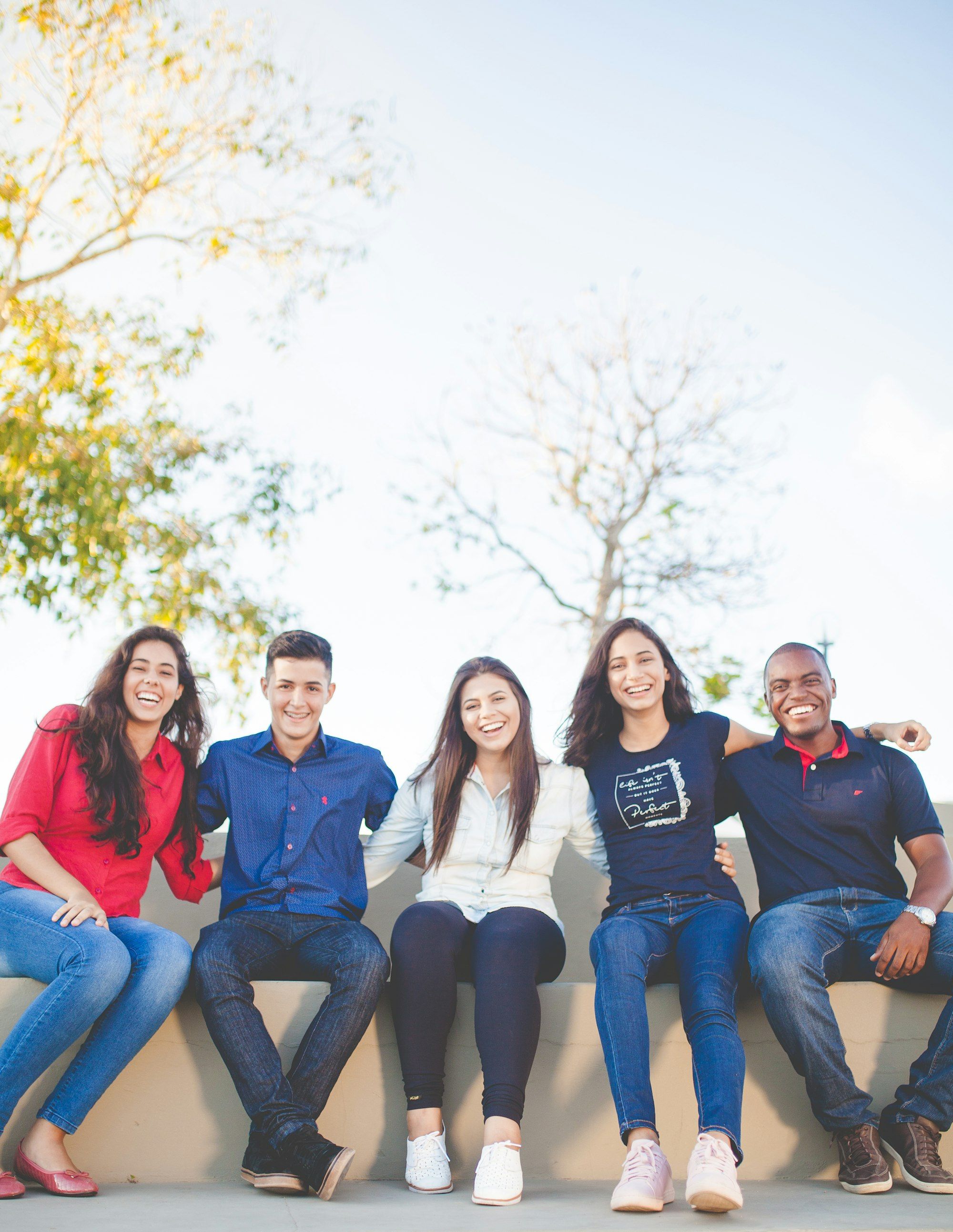 A group of friends laughing together outdoors