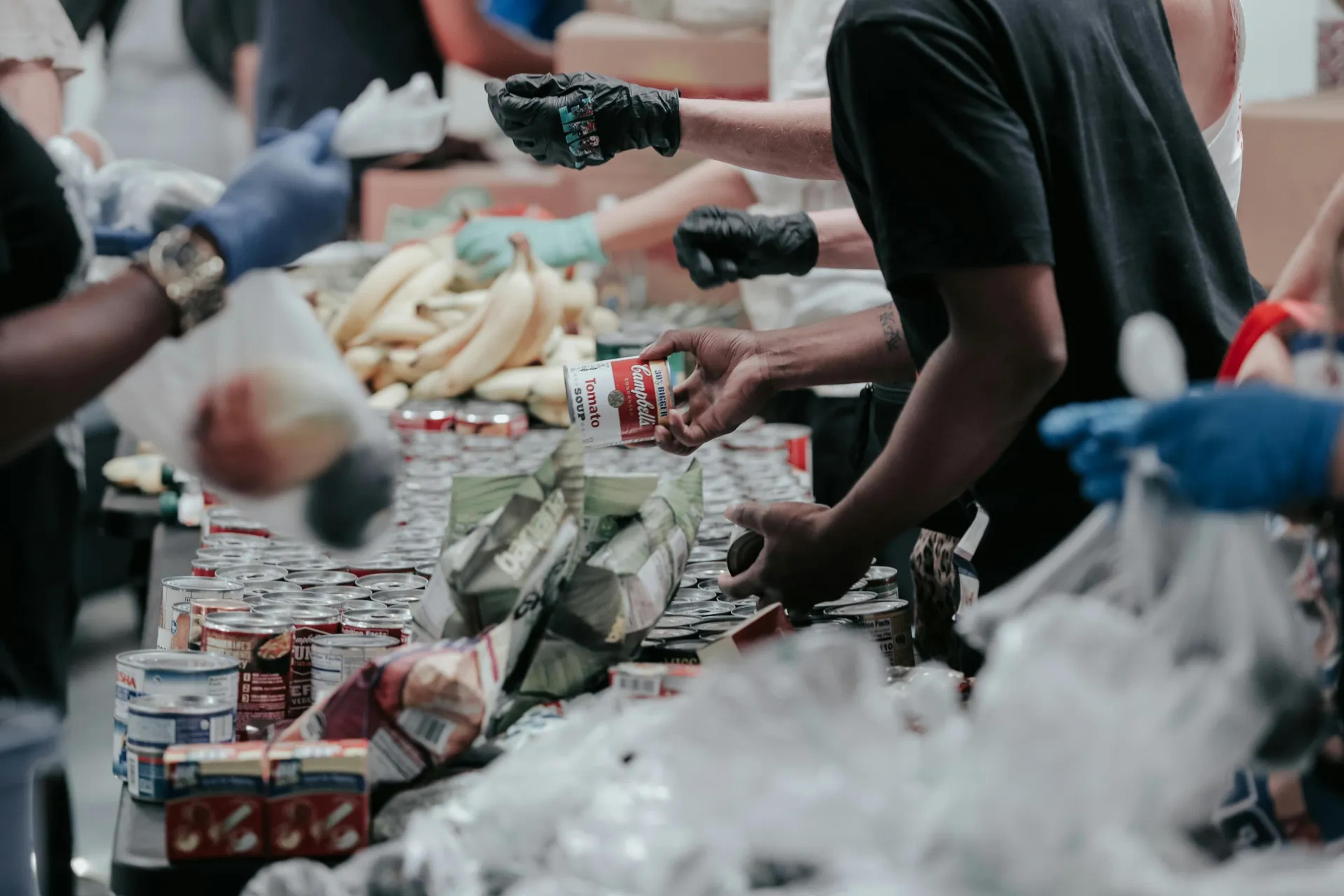 People handing out food at a food bank
