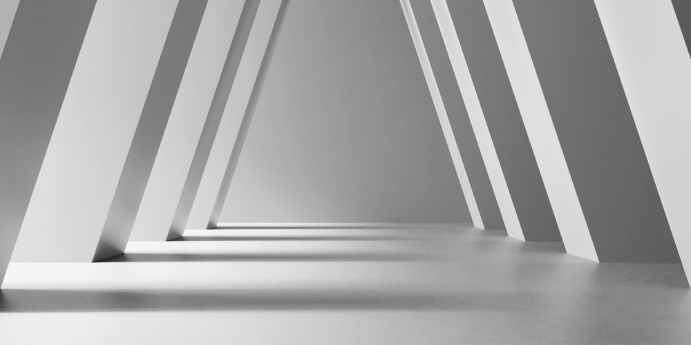 High-contrast architectural photograph of symmetrical, monolithic white concrete pillars angling inward to support a vaulted hallway ceiling, creating rhythmic patterns of sharp geometric shadows to visually represent the balanced, load-bearing operating partnership between the CMO and the CFO.