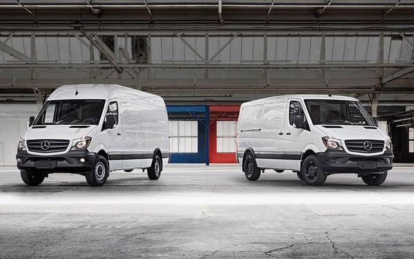 Two Mercedes-Benz Sprinter vans in warehouse — ideal commercial vehicles for Irish business owners seeking van finance, leasing, or fleet funding options