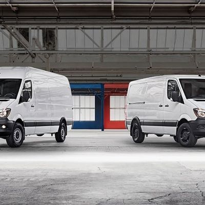 Two Mercedes-Benz Sprinter vans in warehouse — ideal commercial vehicles for Irish business owners seeking van finance, leasing, or fleet funding options