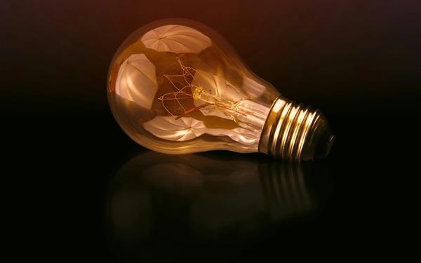 SBCI loans guide concept image: a glowing light bulb on a dark background representing key things to know before applying.