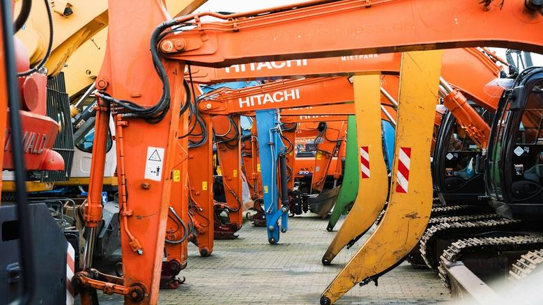Row of Hitachi and Liebherr excavators in Ireland — construction plant machinery and heavy equipment for hire, finance, and contractors