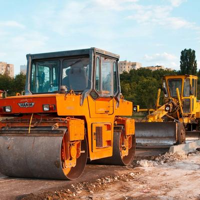 Road roller and grader machinery working on construction site in Ireland — heavy equipment for roadworks, civil engineering, and plant finance