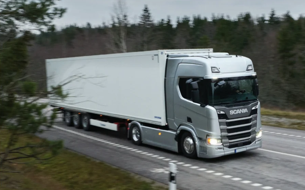 Scania articulated lorry transporting goods on an Irish countryside road — commercial haulage and logistics truck in Ireland.