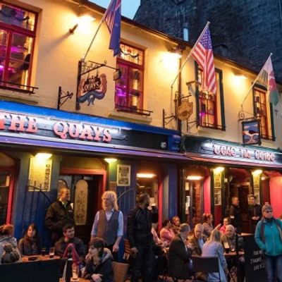 busy Irish pub with people socialising, reflecting Ireland’s community, tourism, and small-business support schemes available in 2026.