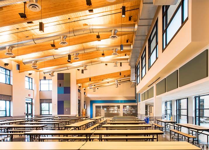Jemtegaard Middle and Columbia River Gorge Elementary School Commons designed by LSW Architects to create a comfortable eating environment with vaulted wood ceilings and large windows.