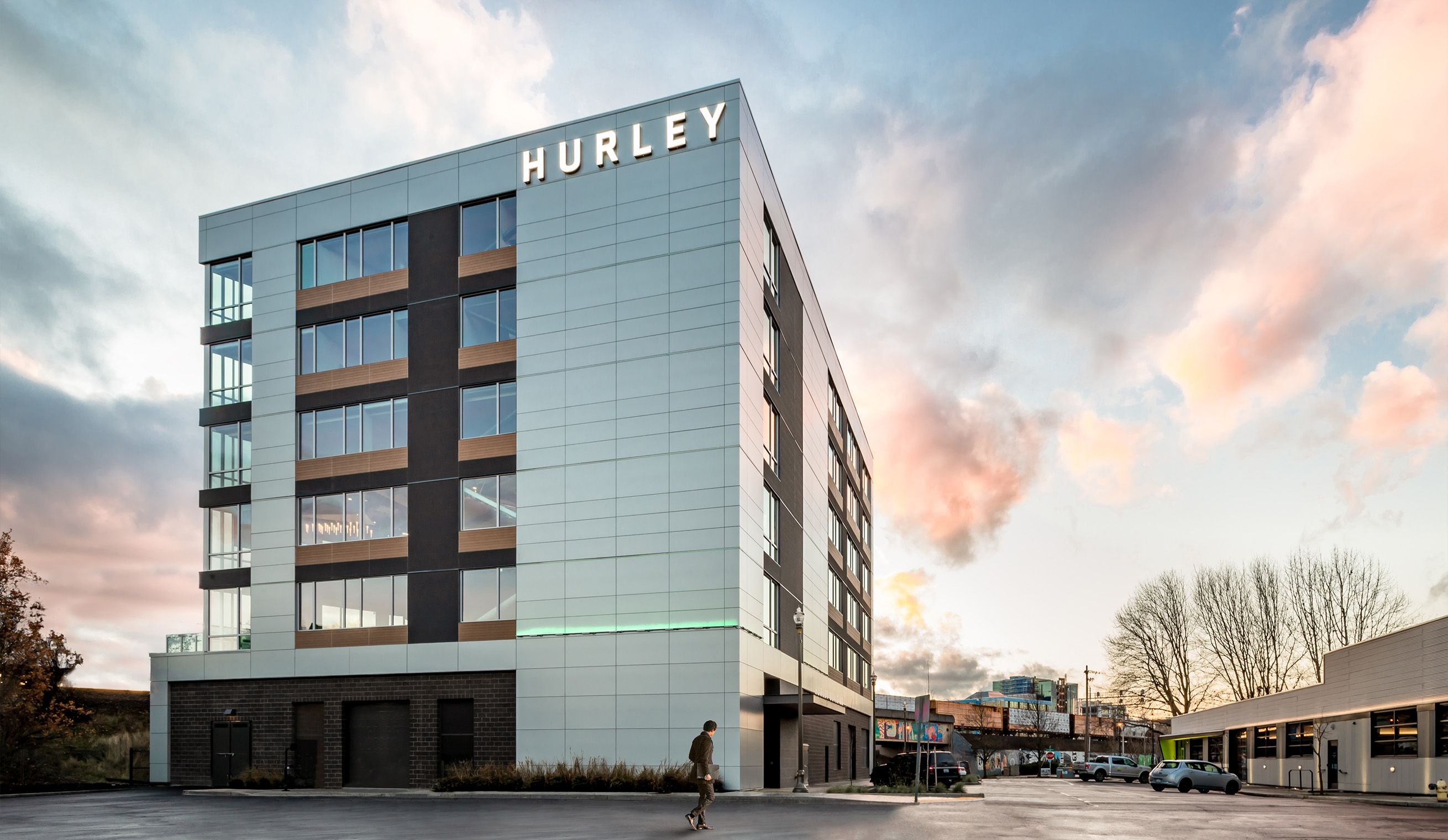 An outside shot of the Hurley Building Downtown Vancouver with a sunset sky