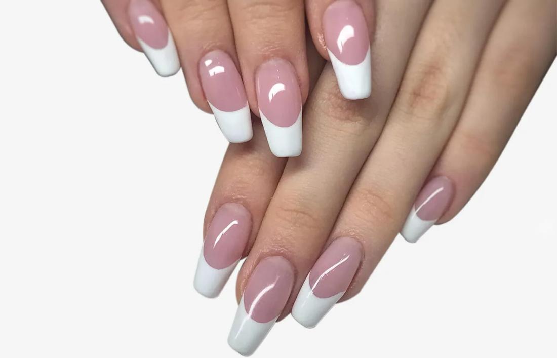 A woman having French nail Extension