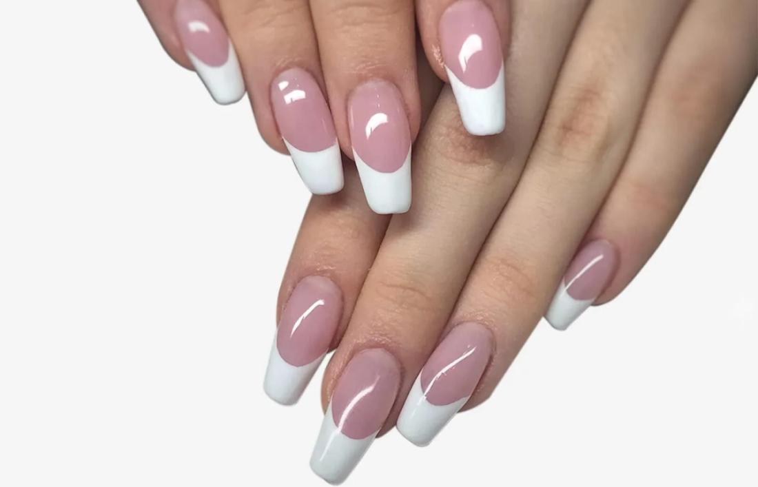 A woman having French nail Extension