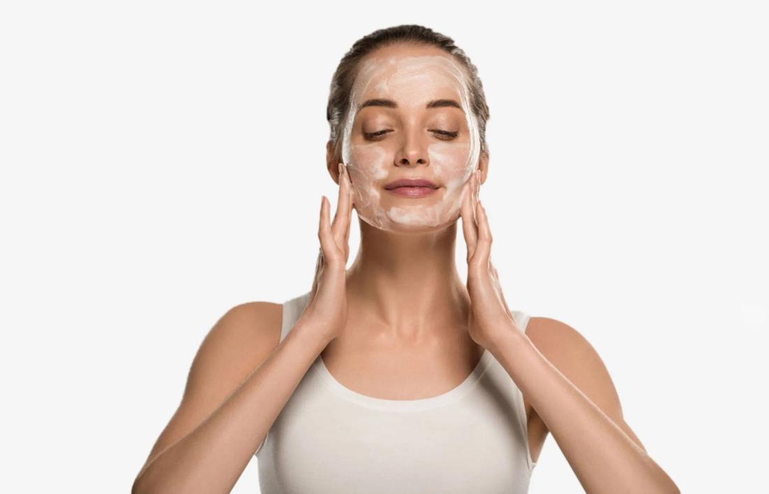 A woman Cleansing her face