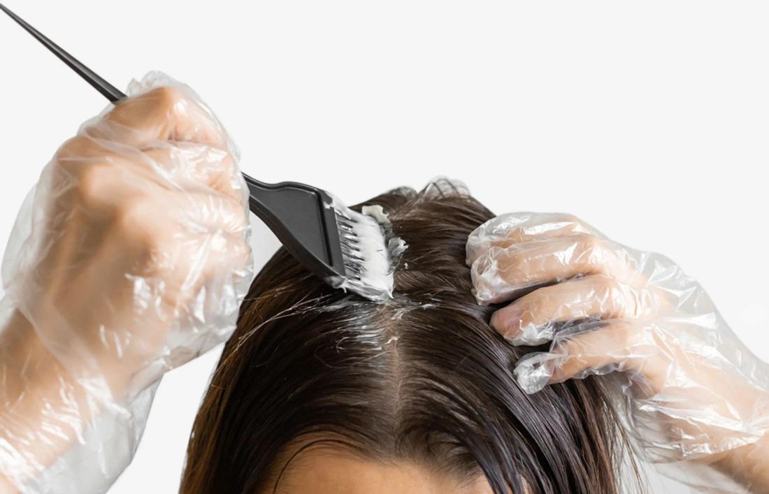 A woman drying her hair after wash