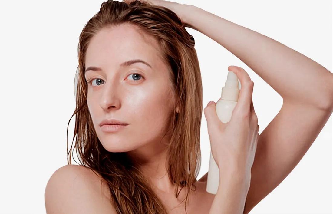 A girl applying conditioner