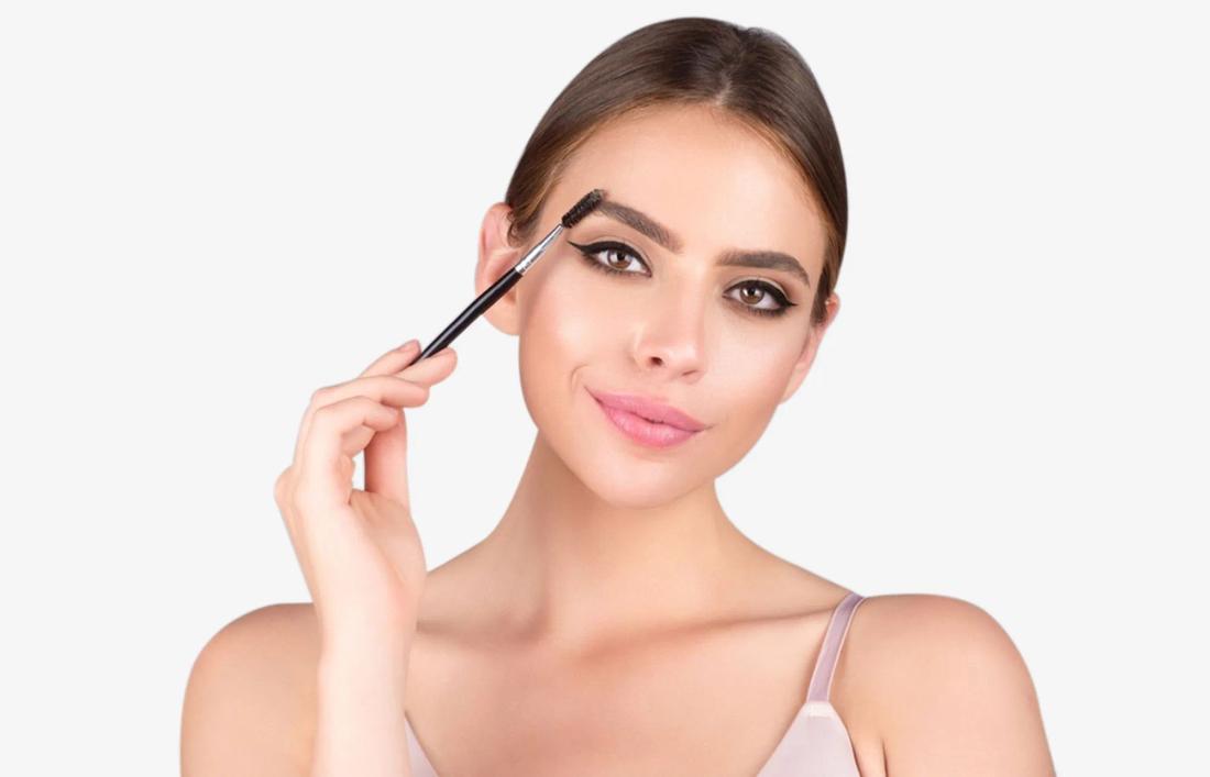 A woman making her eyebrows bold