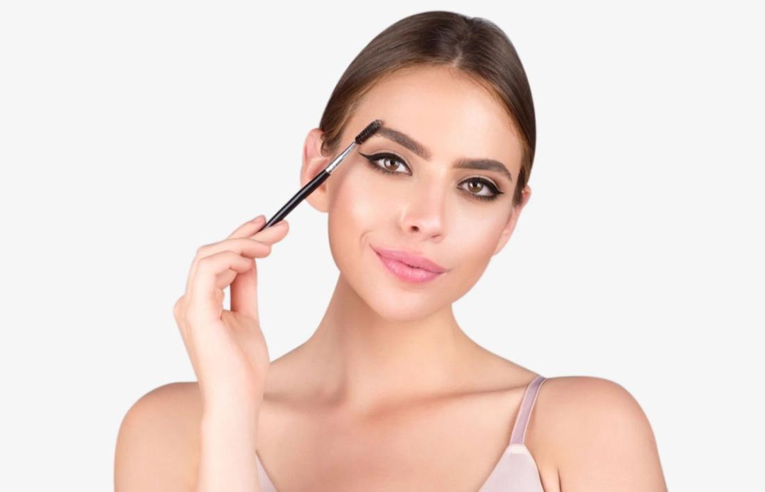 A woman making her eyebrows bold