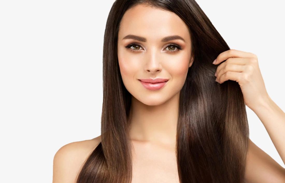 A woman smiling and showing her rebonded hairs