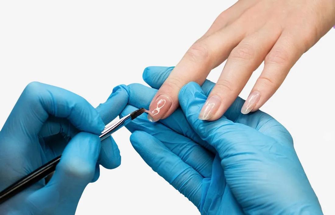 A woman having nail art on her extension