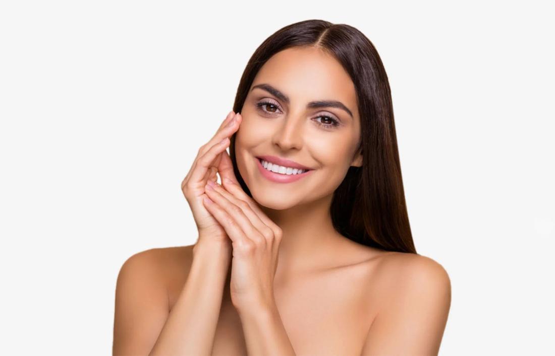 A woman smiling as she founded her skin type