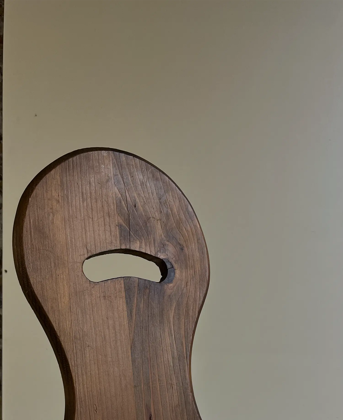 Brutalist wooden three legged chair, view 4