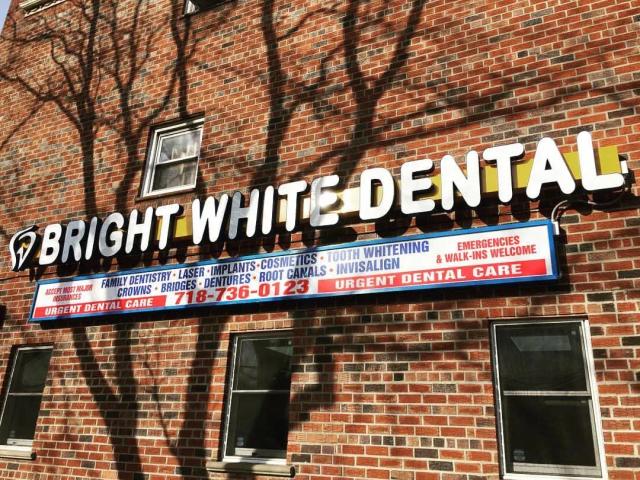 sign of bright white dental storefront sign