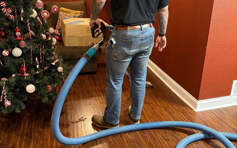 Ranger Recovery technician performing basement water damage cleanup and structural drying in a home