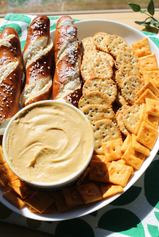 Cheese dip with pretzels and crackers