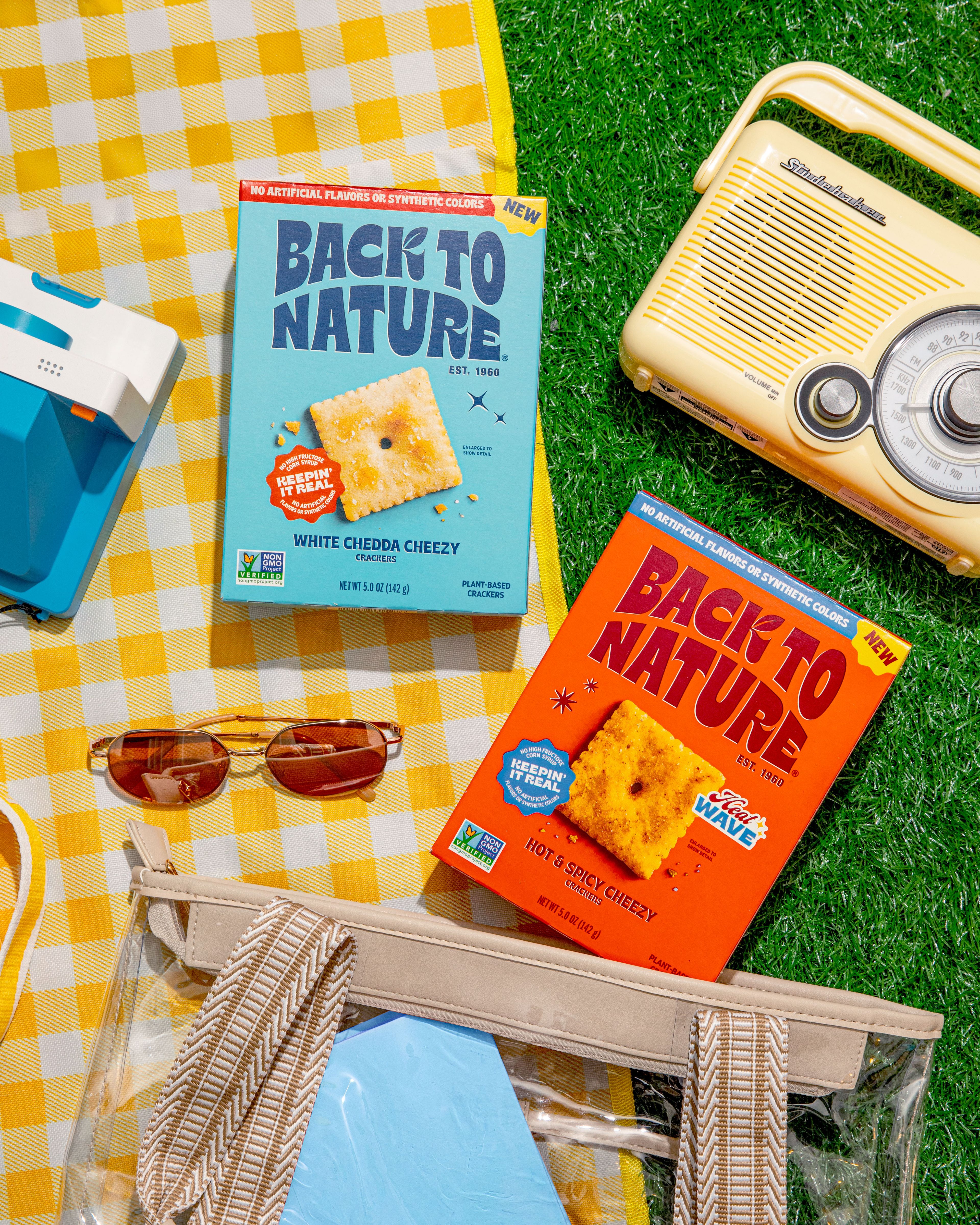Back to Nature White chedda and hot & spicy cheezy crackers on a picnic blanket