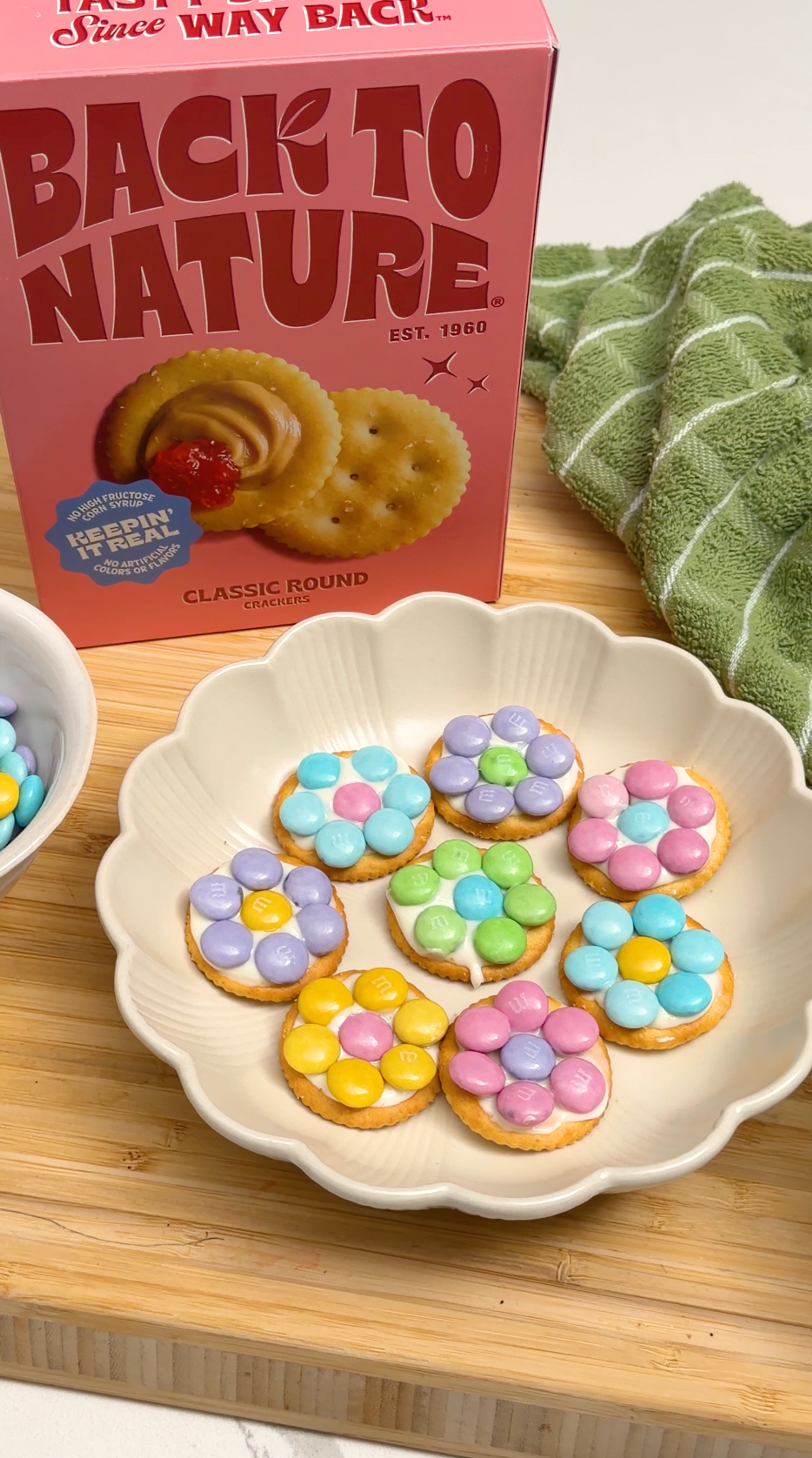 Classic round crackers with a sweet topping: frosting and colored chocolate candies