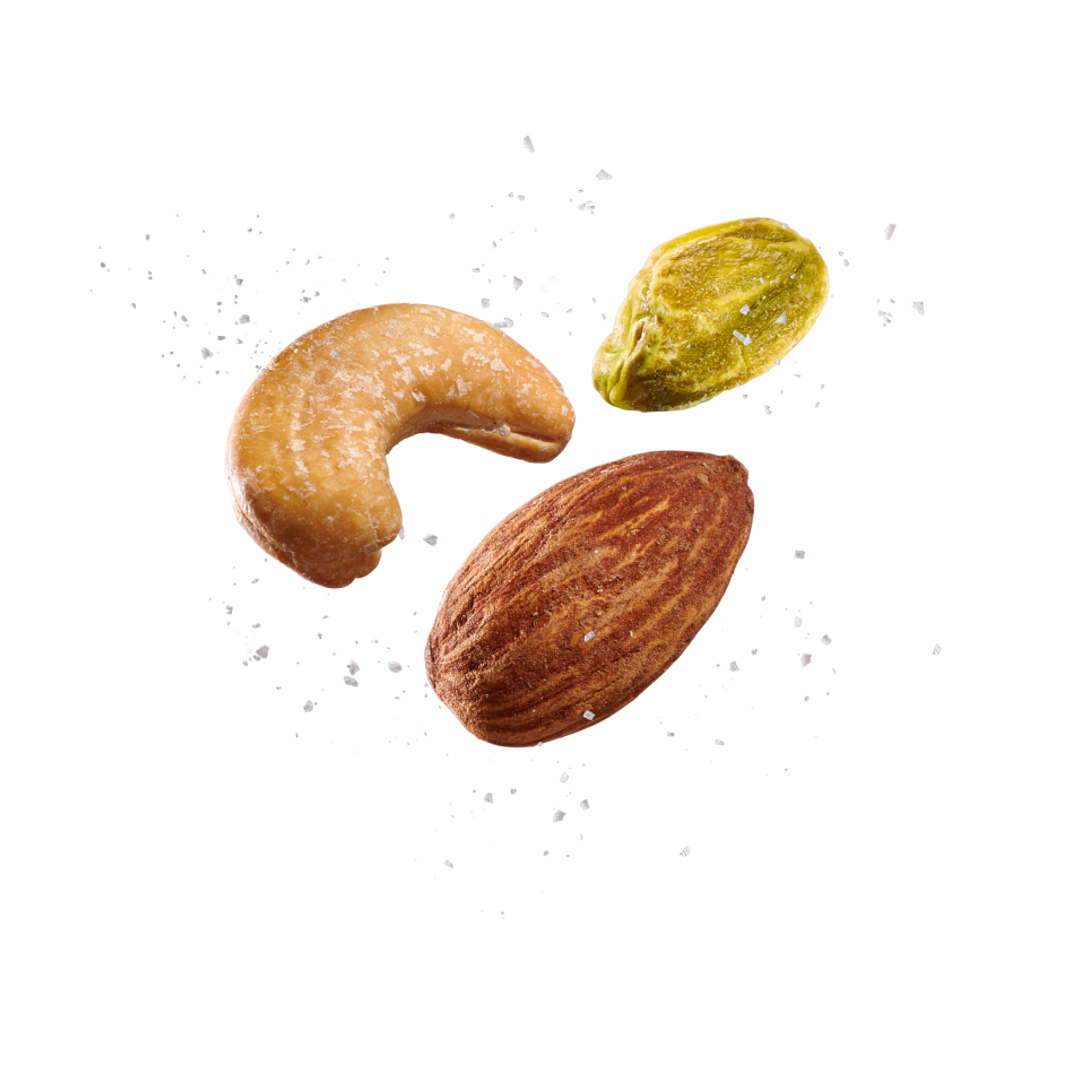 Three nuts, one whole almond, one cashew, and one shelled pistachio, with salt float on a green background