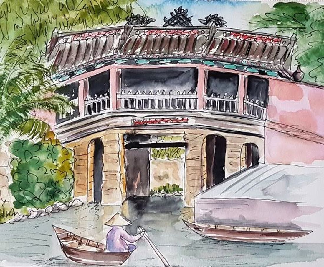 A traveller on the Japanese Covered Bridge in old Hoi An