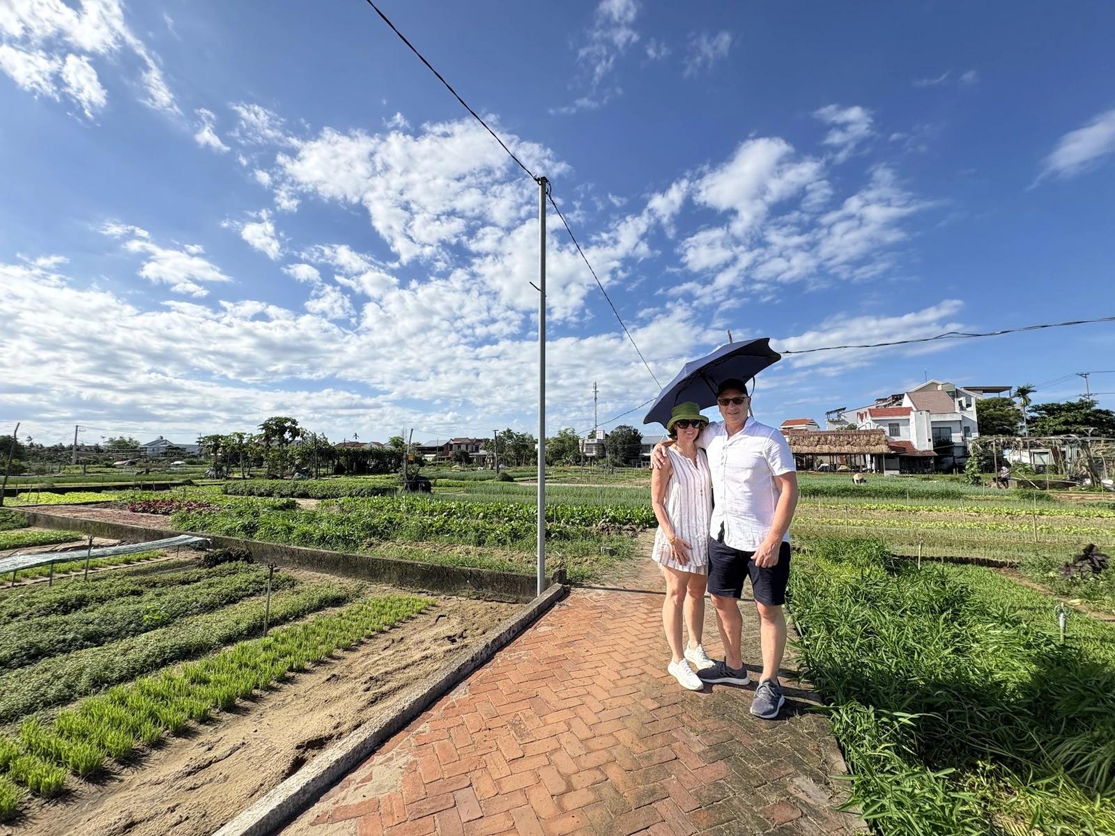 Quiet village lane between gardens on the cycling tour outside Hoi An Ancient Town.