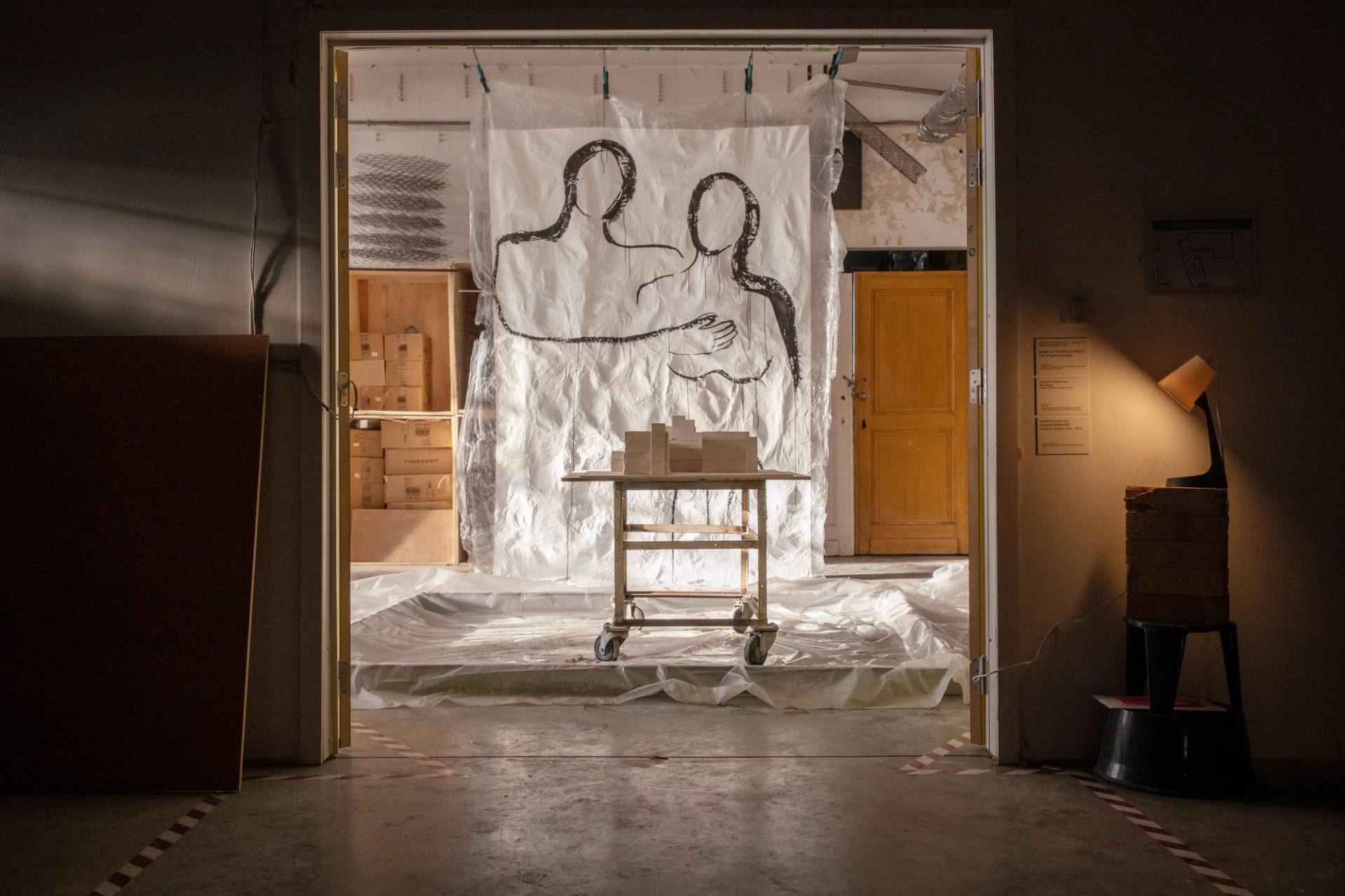 a painting of two people holding each other