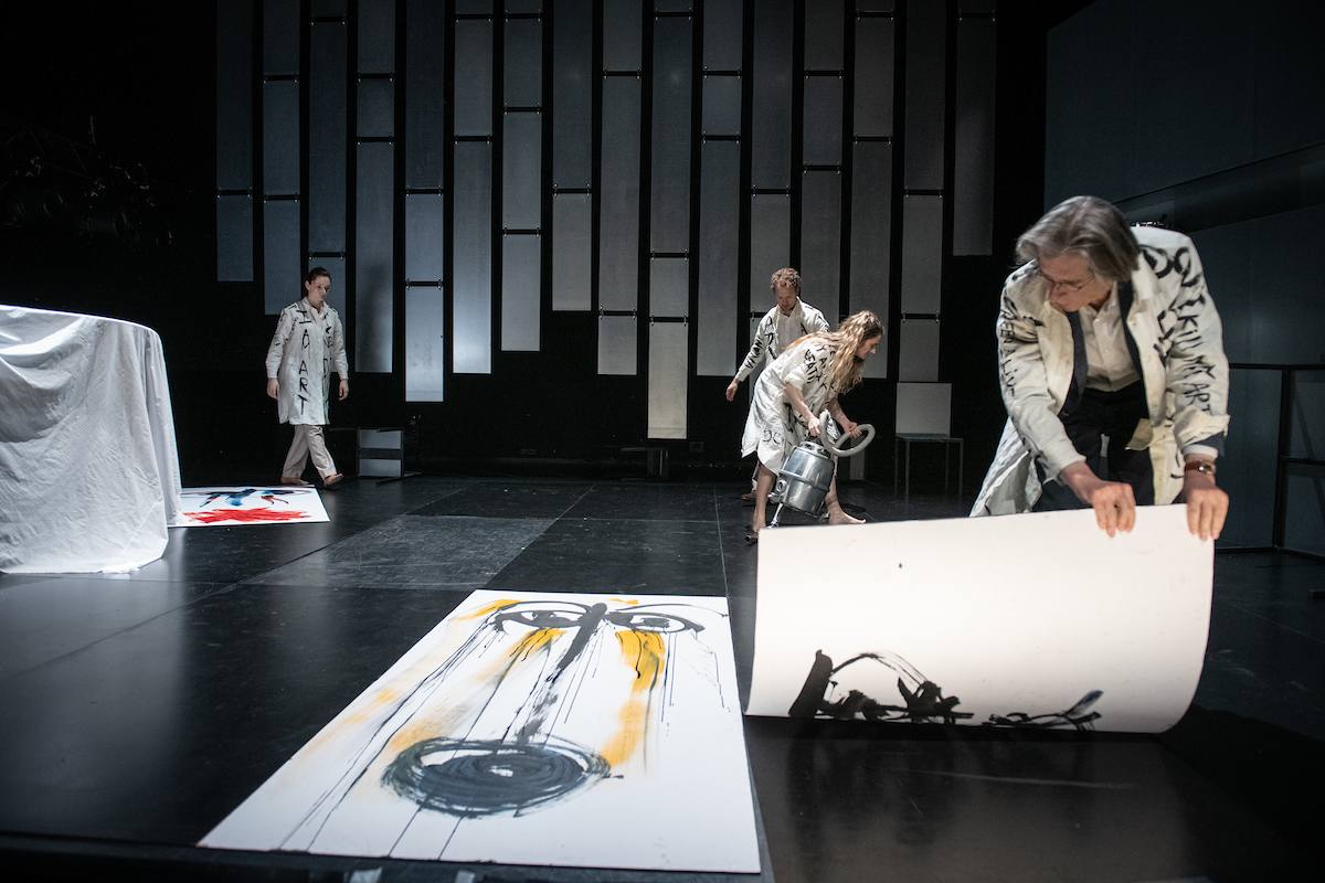 people lifting paintings