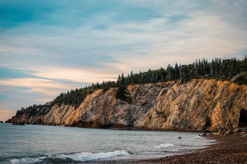 Sunset over beach on Cabot Trail