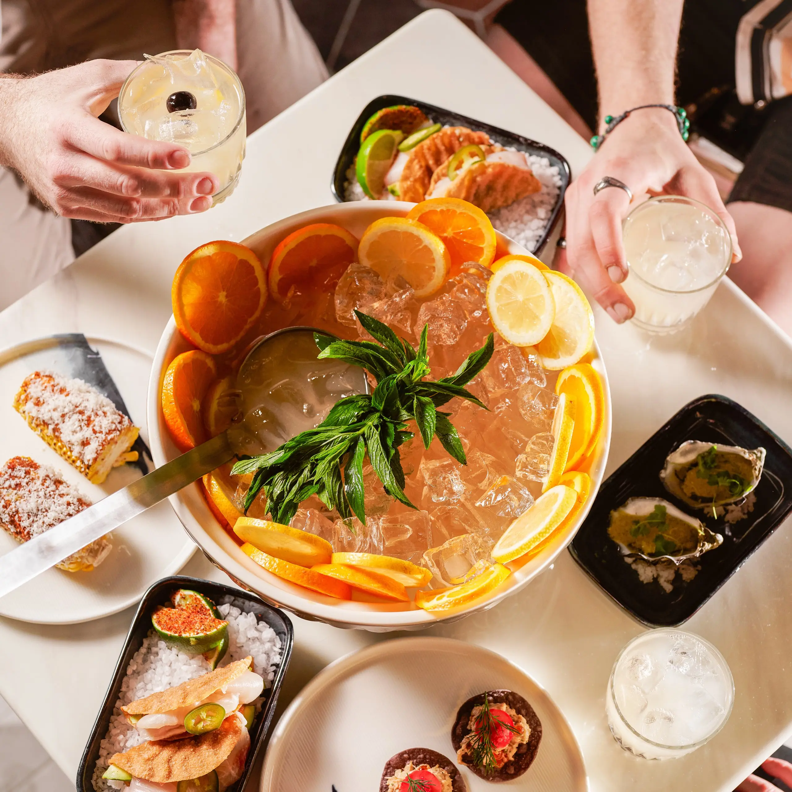 Sharing punch bowl with food